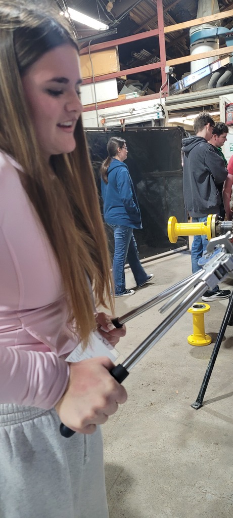 Daniela trying out the straw maker
