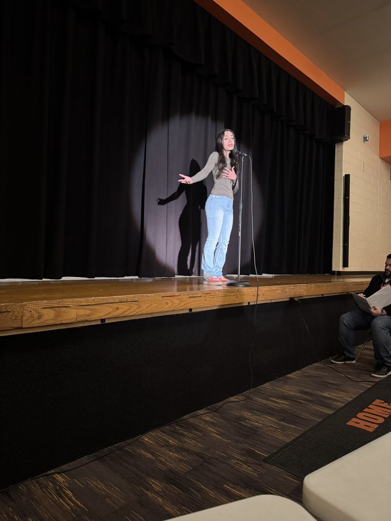 Student reciting poetry