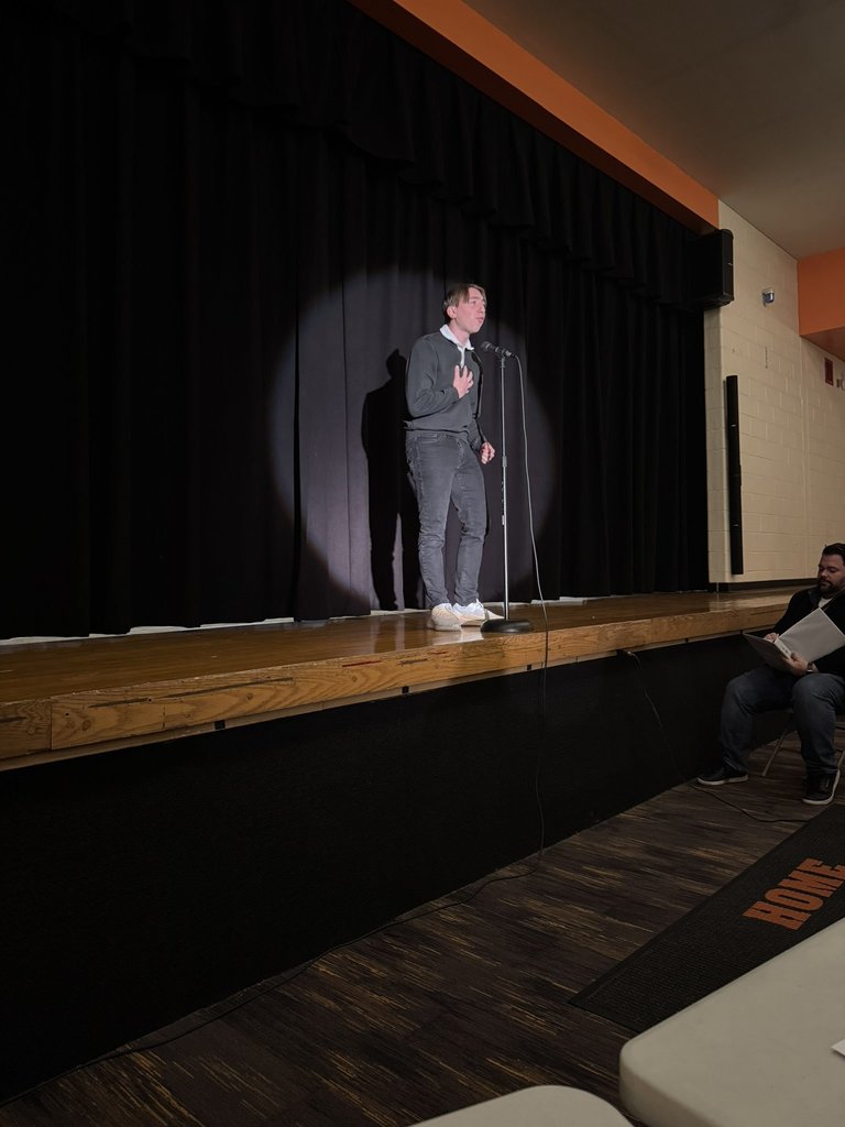 Student reciting poetry