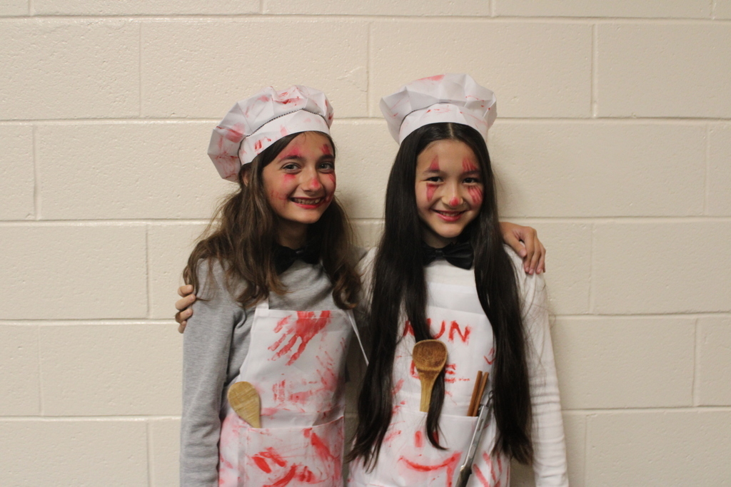Kids posing in Halloween costumes. 