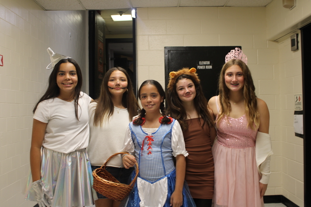 Kids posing in Halloween costumes. 