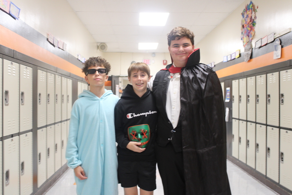 Kids posing in Halloween costumes. 