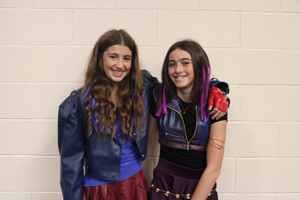 Kids posing in Halloween costumes. 