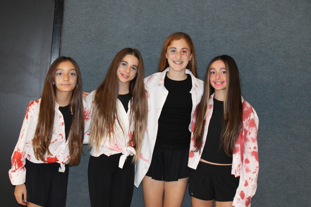 Kids posing in Halloween costumes. 