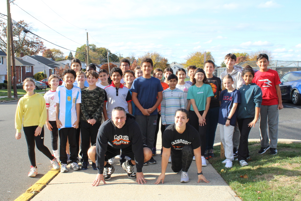 Students posing with Miss Coffey and Mr. Mastro, ready to race!