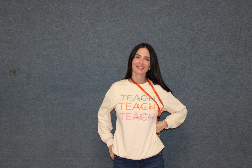 A teacher (Mrs. DiLascio) wearing a shirt promoting kindness in honor of Kindness Week!