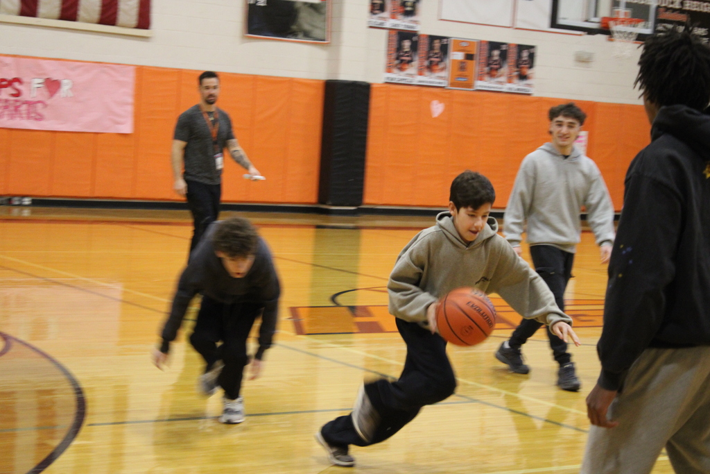 Students playing basketball.