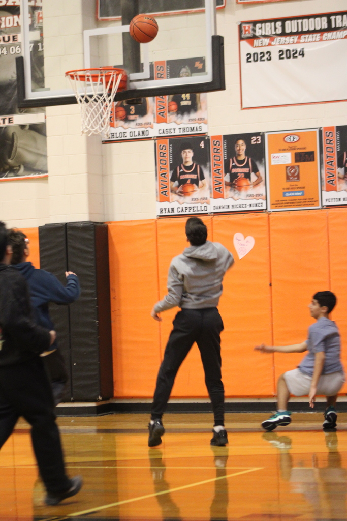 Students playing basketball.