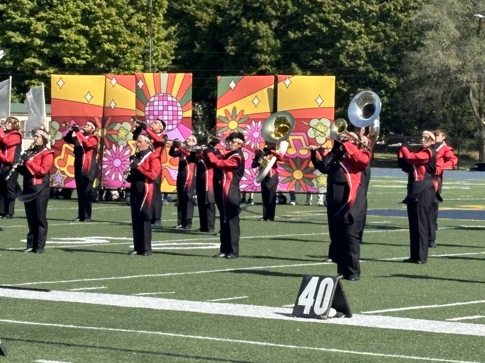 A marching band performing at the Hastings band Invitational