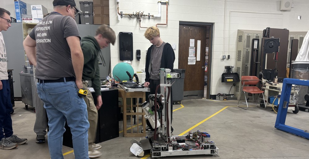 Students work on a robot