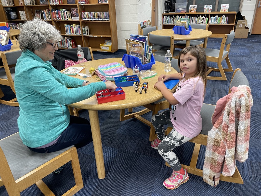 Marci McCoy playing a game with a Southeastern Elementary student