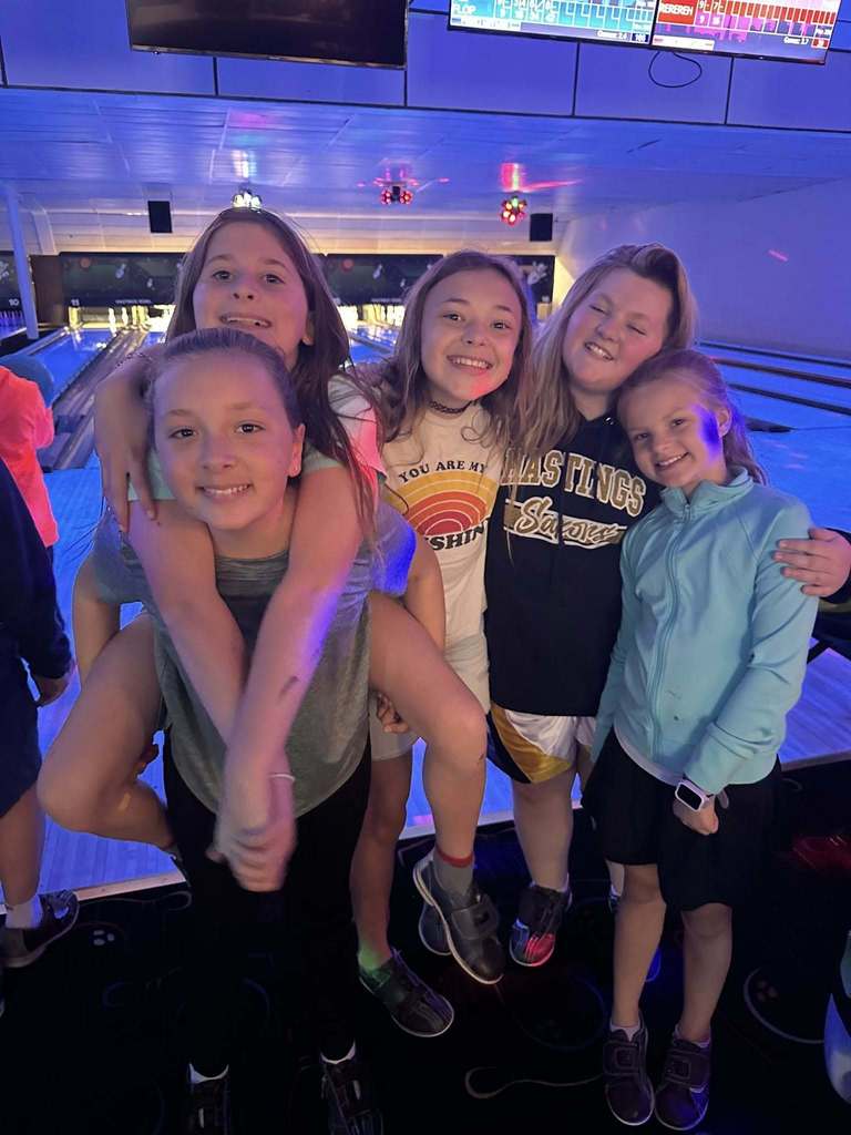 Northeastern Elementary's fifth grade safeties enjoying pizza, popcorn and bowling.