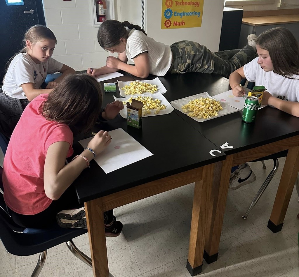 Northeastern Elementary's fifth grade safeties enjoying pizza, popcorn and bowling.