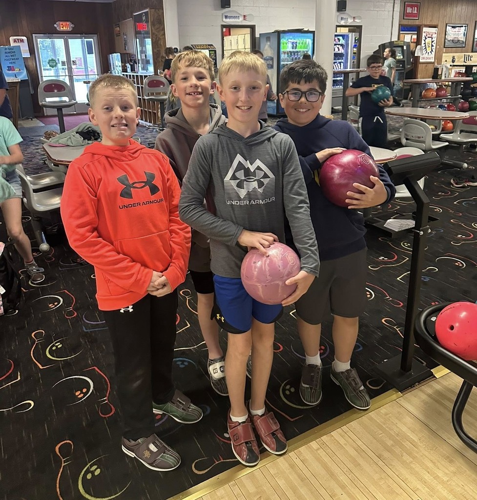 Northeastern Elementary's fifth grade safeties enjoying pizza, popcorn and bowling.