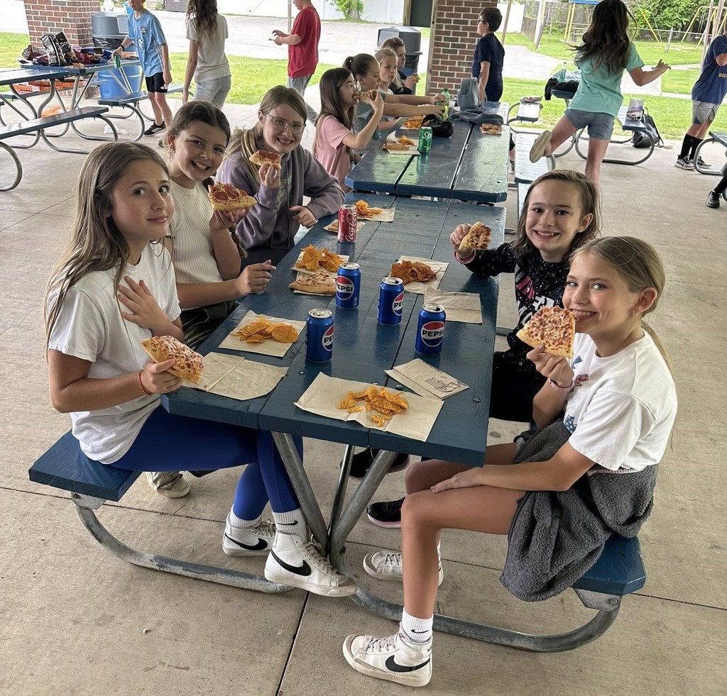Northeastern Elementary's fifth grade safeties enjoying pizza, popcorn and bowling.