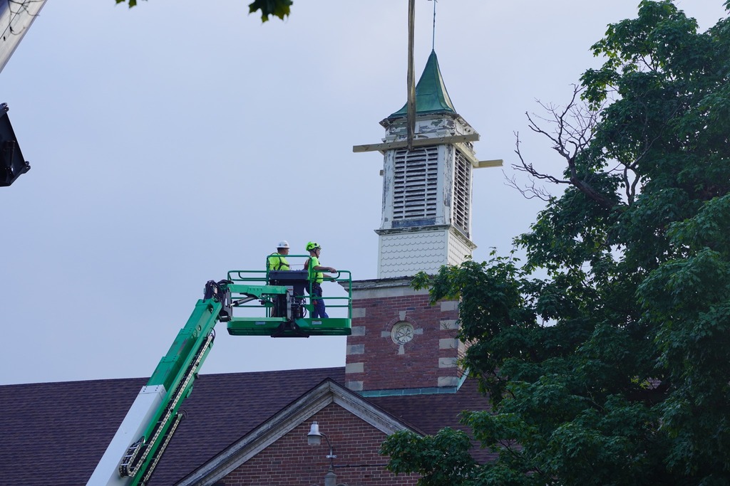 Crews work to remove the bell tower at Central Elementary School.