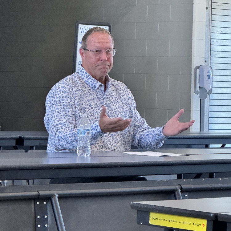 Judge Michael Schipper speaks with parents at Hastings Middle School