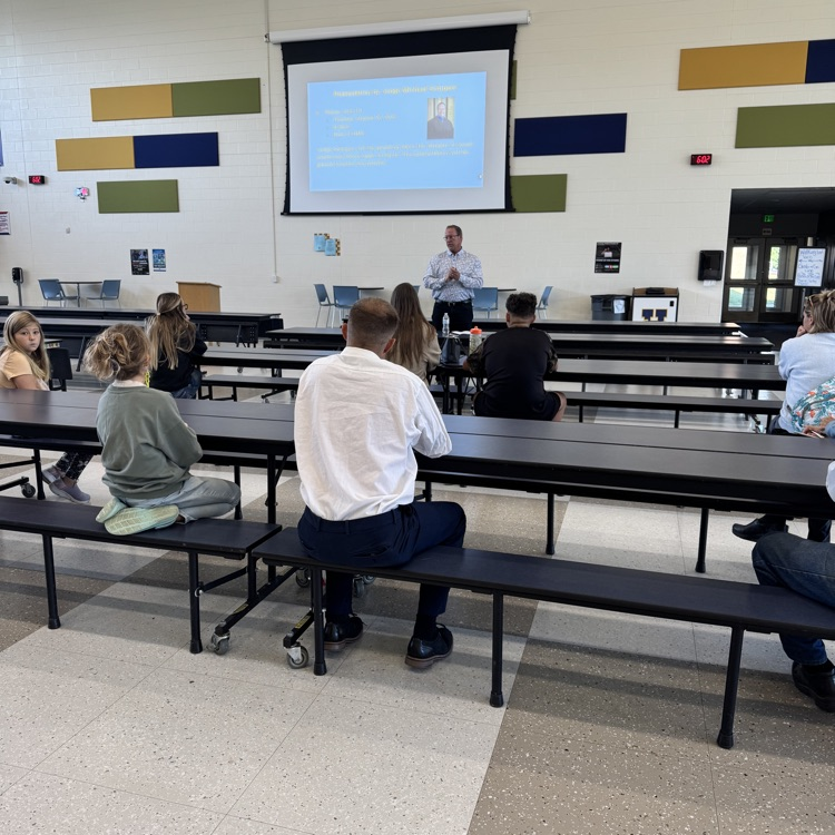 Judge Michael Schipper speaks with parents at Hastings Middle School
