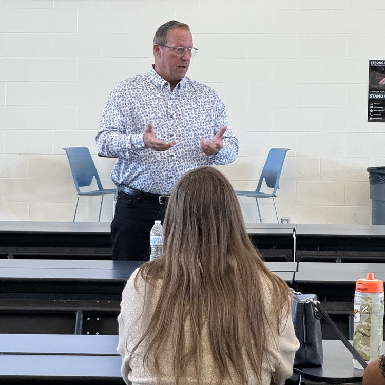 Judge Michael Schipper speaks with parents at Hastings Middle School