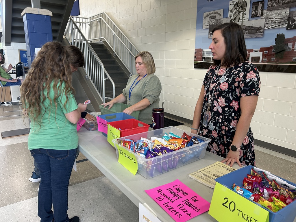 Hastings Middle School students gather around to purchase items with their PRIDE tickets.
