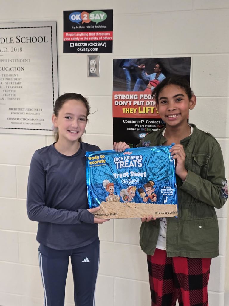 Students displaying a two-pound Rice Krispies Treat.