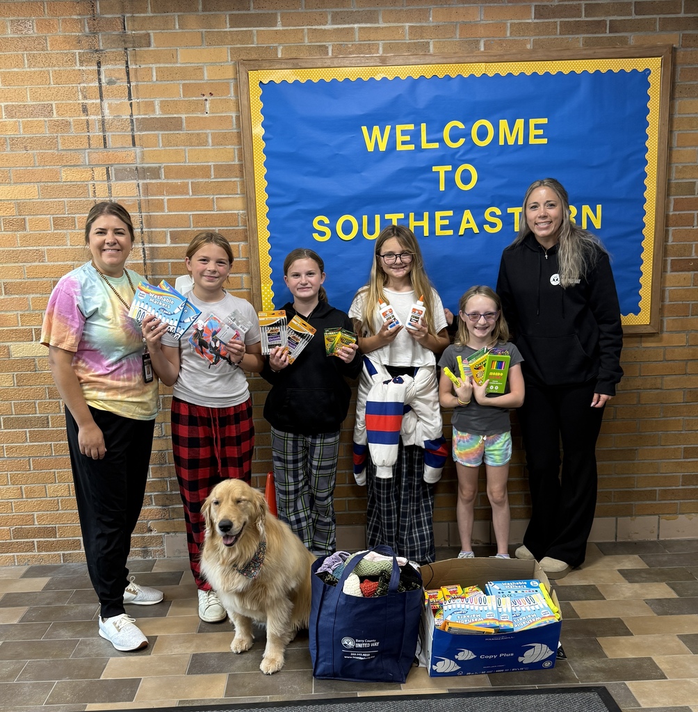 Morgan Johnson of the Barry County United Way pictured with Southeastern Elementary Principal Kelly Wilson and student council members with some school supplies.