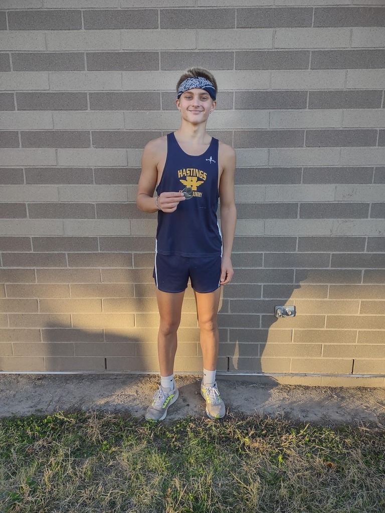 Caleb Kramer displaying his all-county medal.