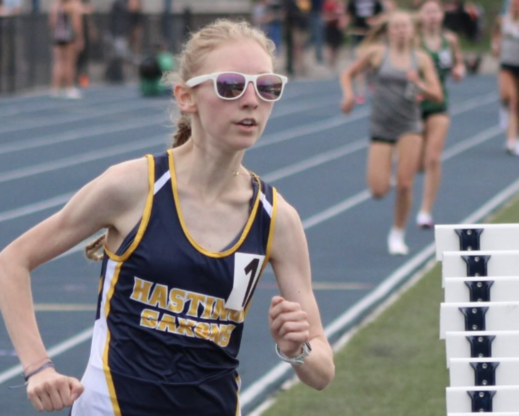 Caroline Randall rounds the corner on the track while running