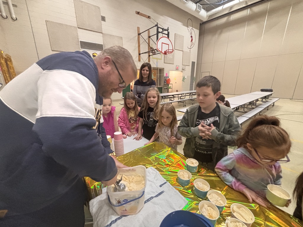 Students at Central Elementary enjoy ice cream in the school gym.