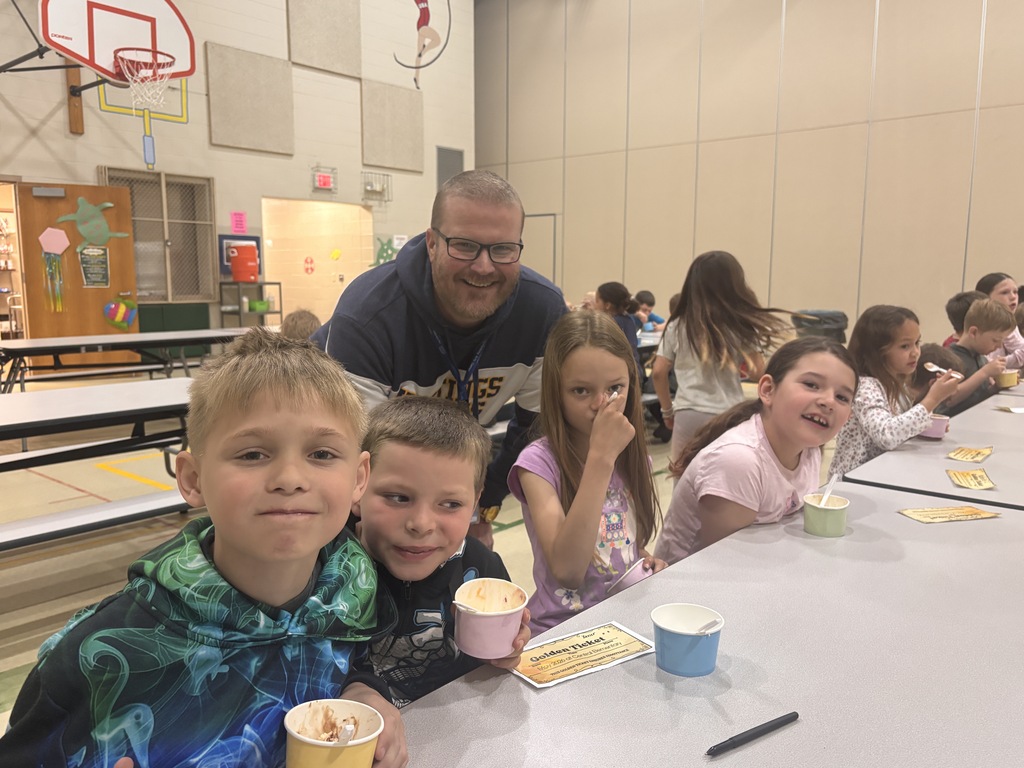 Students at Central Elementary enjoy ice cream in the school gym.