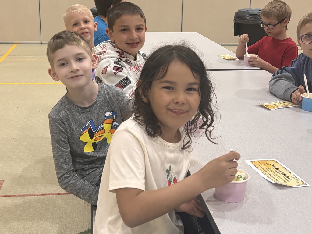 Students at Central Elementary enjoy ice cream in the school gym.