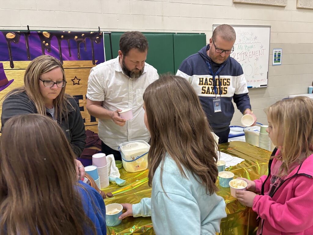 Students at Central Elementary enjoy ice cream in the school gym.