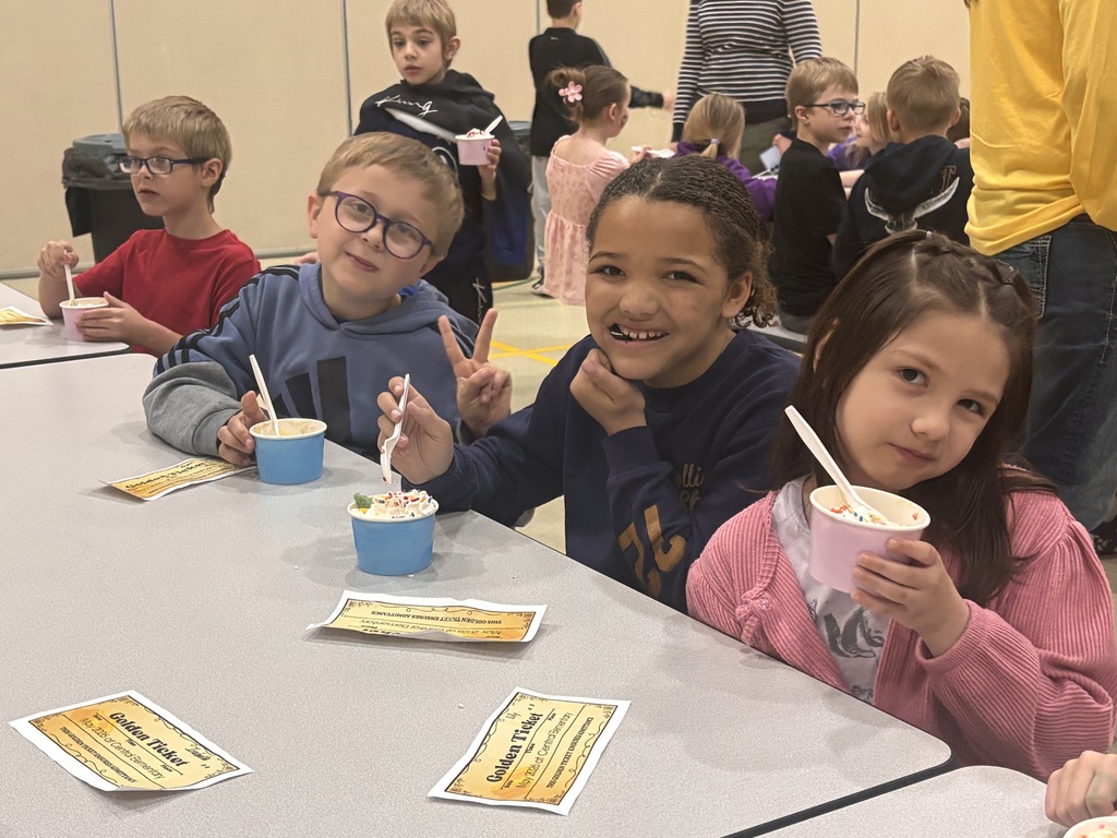 Students at Central Elementary enjoy ice cream in the school gym.