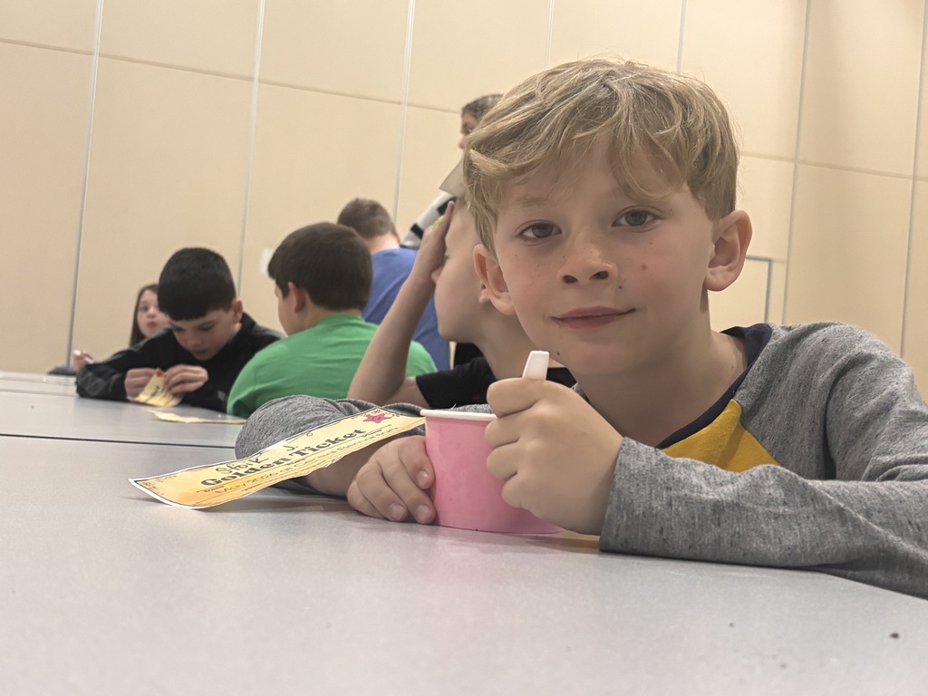 Students at Central Elementary enjoy ice cream in the school gym.