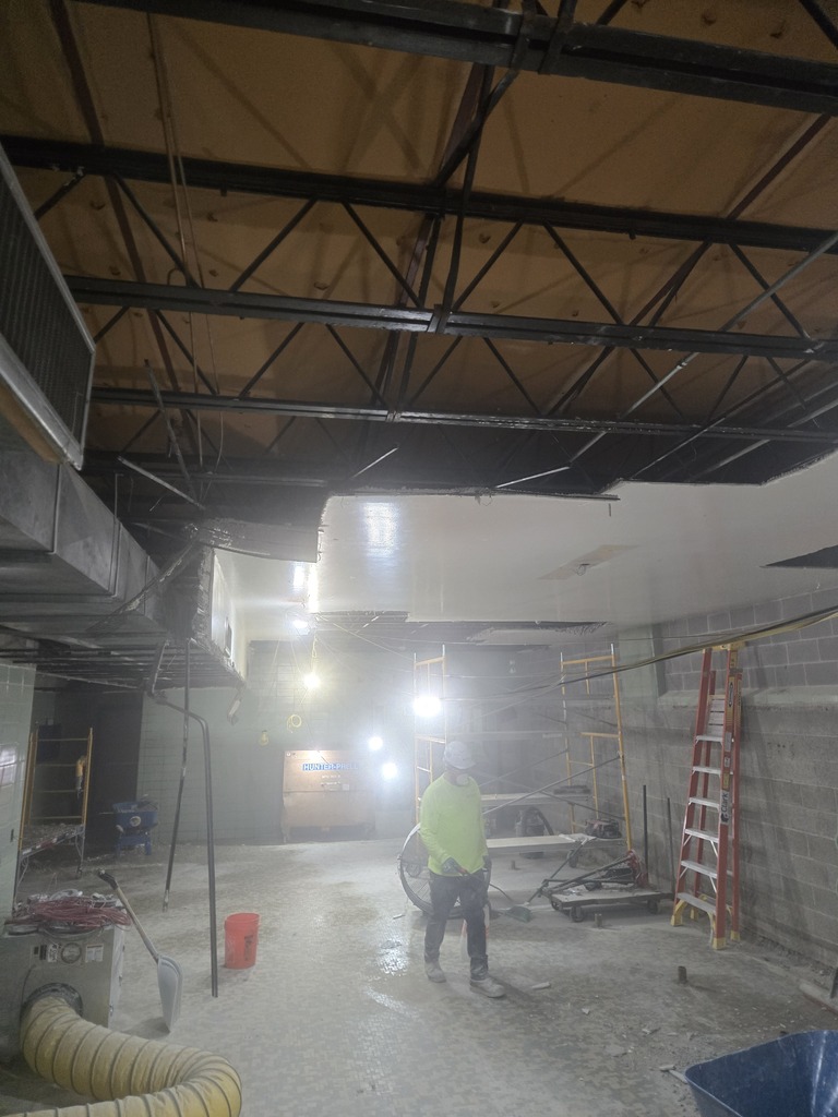 A dark, indoor construction site