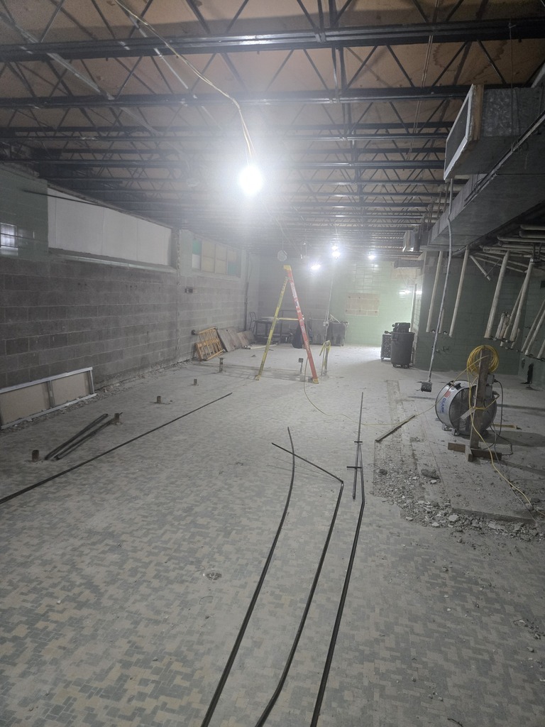 A dark, indoor construction site