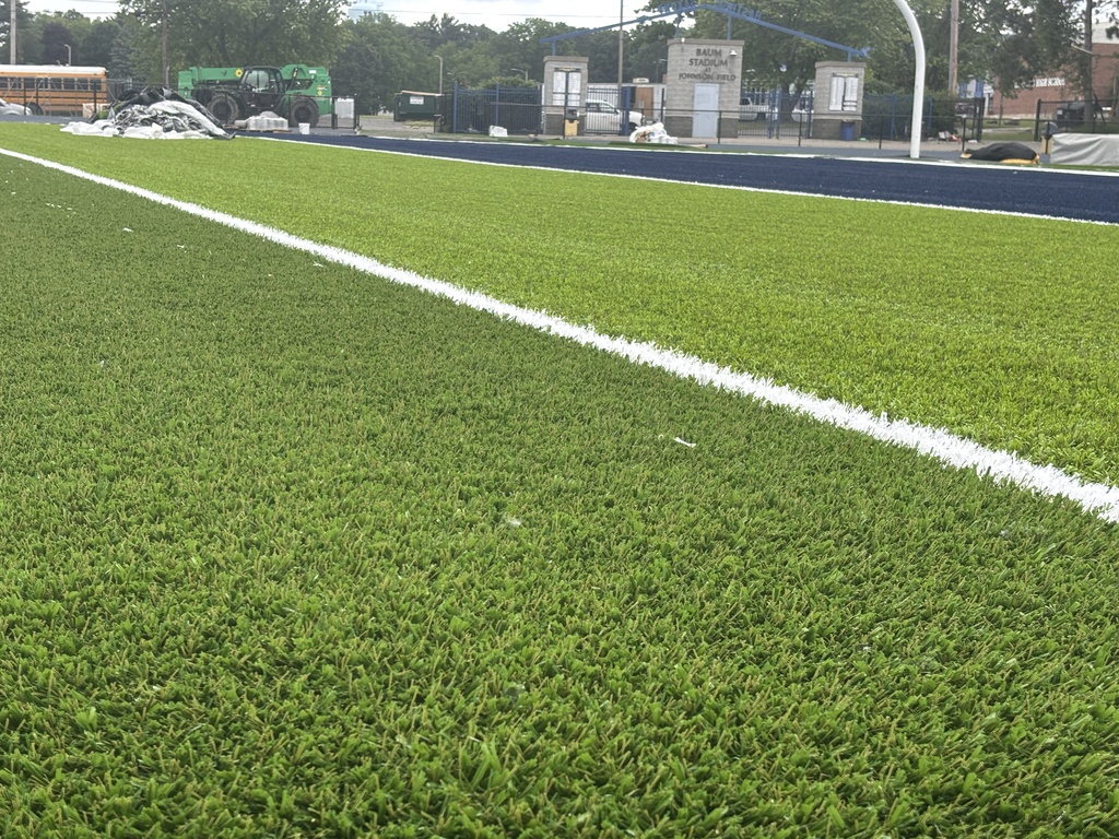 A close look at artificial turf on a football field