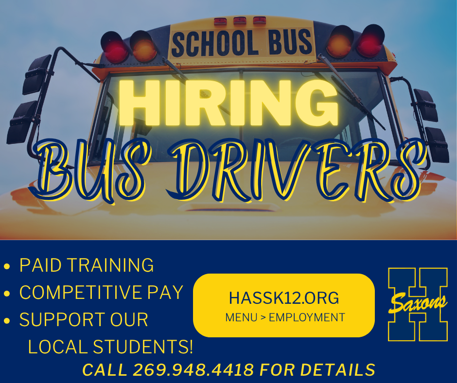 The front of a school bus with text over it saying "Hiring Bus Drivers"
