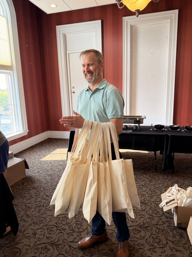 People work to pack up bags of hygeine products