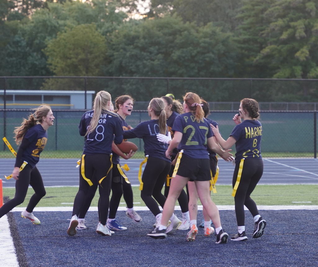 Players participating in a Powderpuff football game