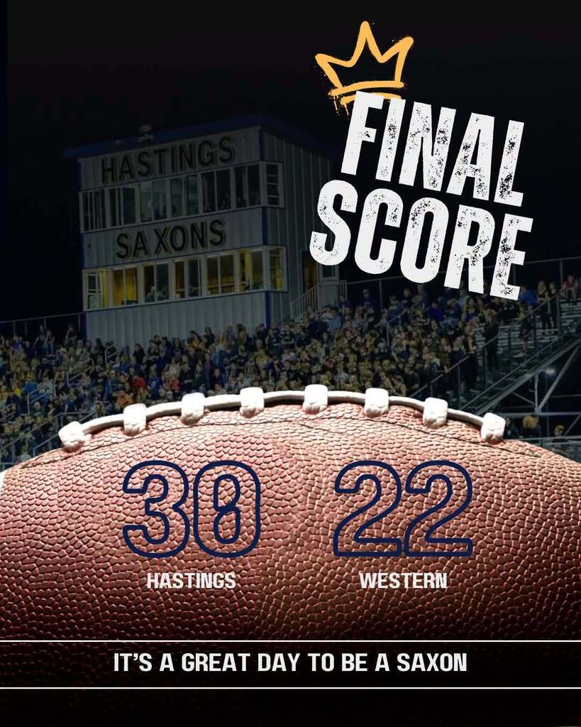 a football graphic showing the final score of the game. a press box can be seen in the background with lettering that says Hastings Saxons