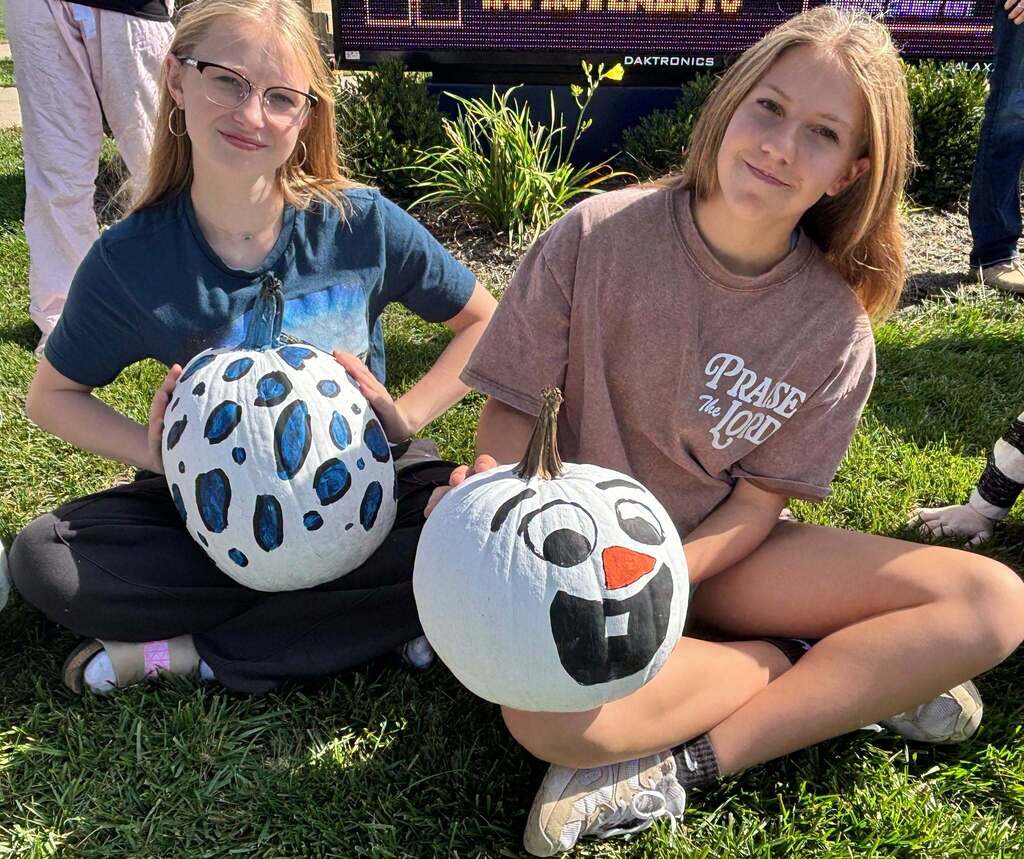 School kids display painted pumpkins