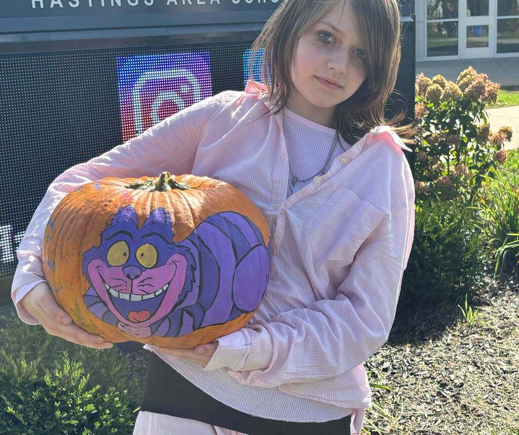 School kids display painted pumpkins