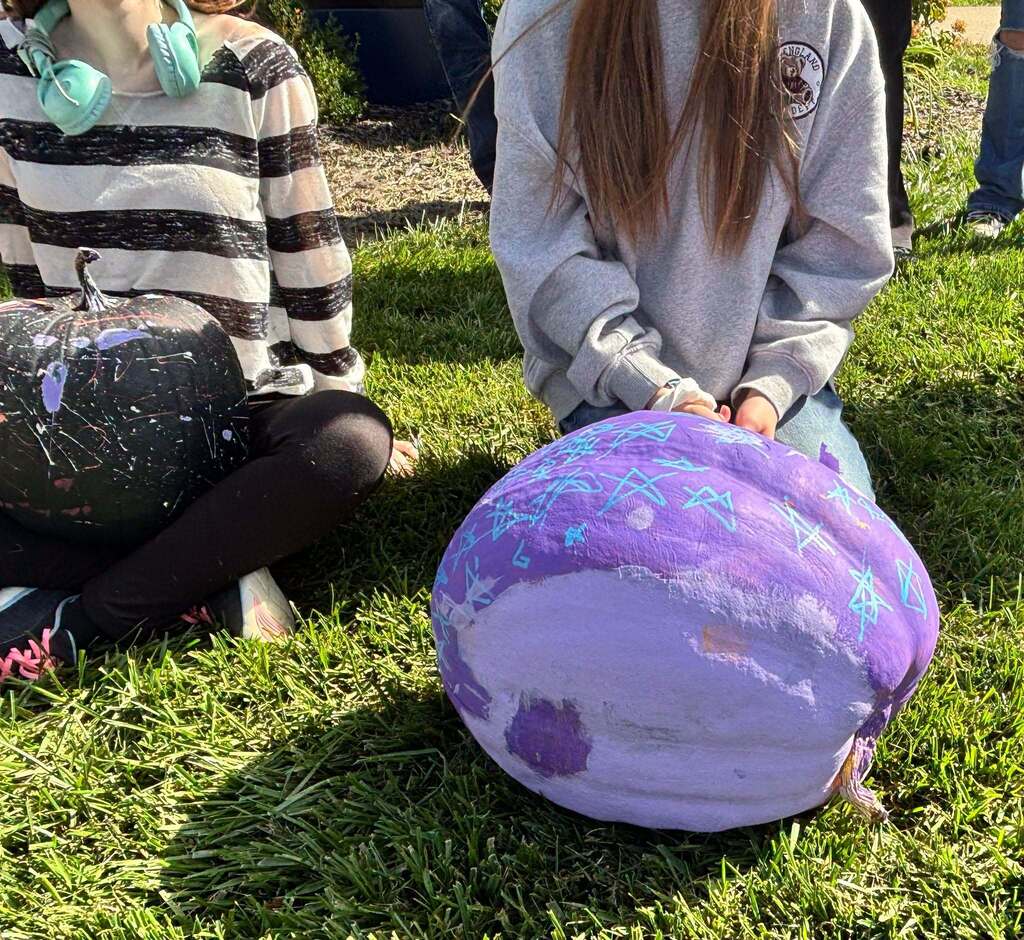School kids display painted pumpkins