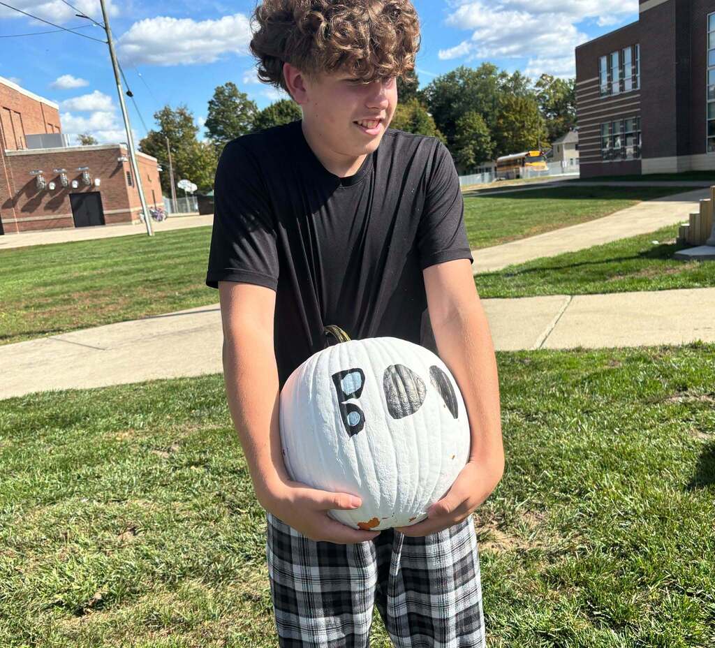 School kids display painted pumpkins