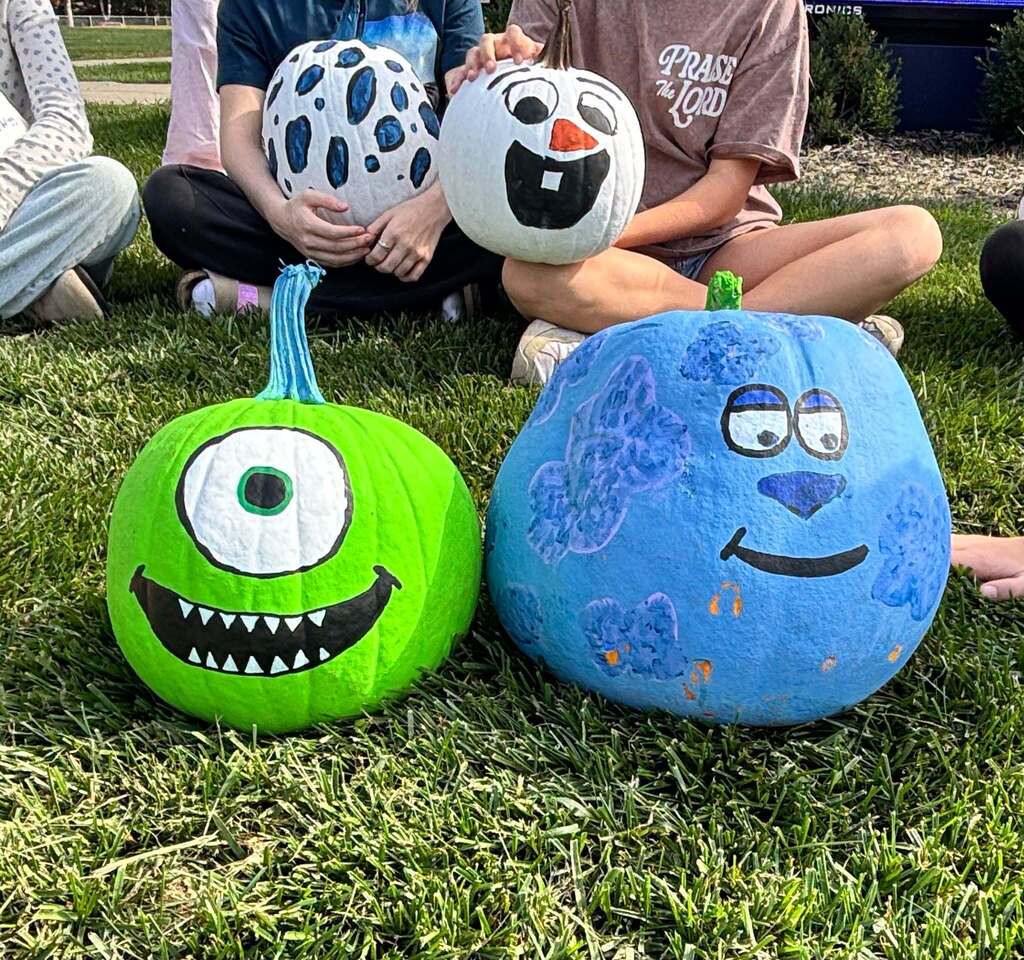 School kids display painted pumpkins