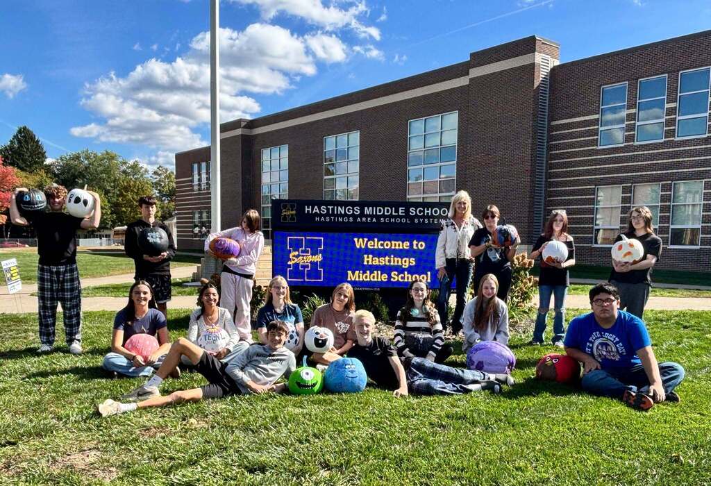 School kids display painted pumpkins