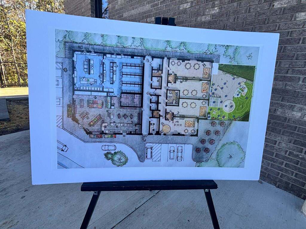 A photo of blue prints that show the inside of building.