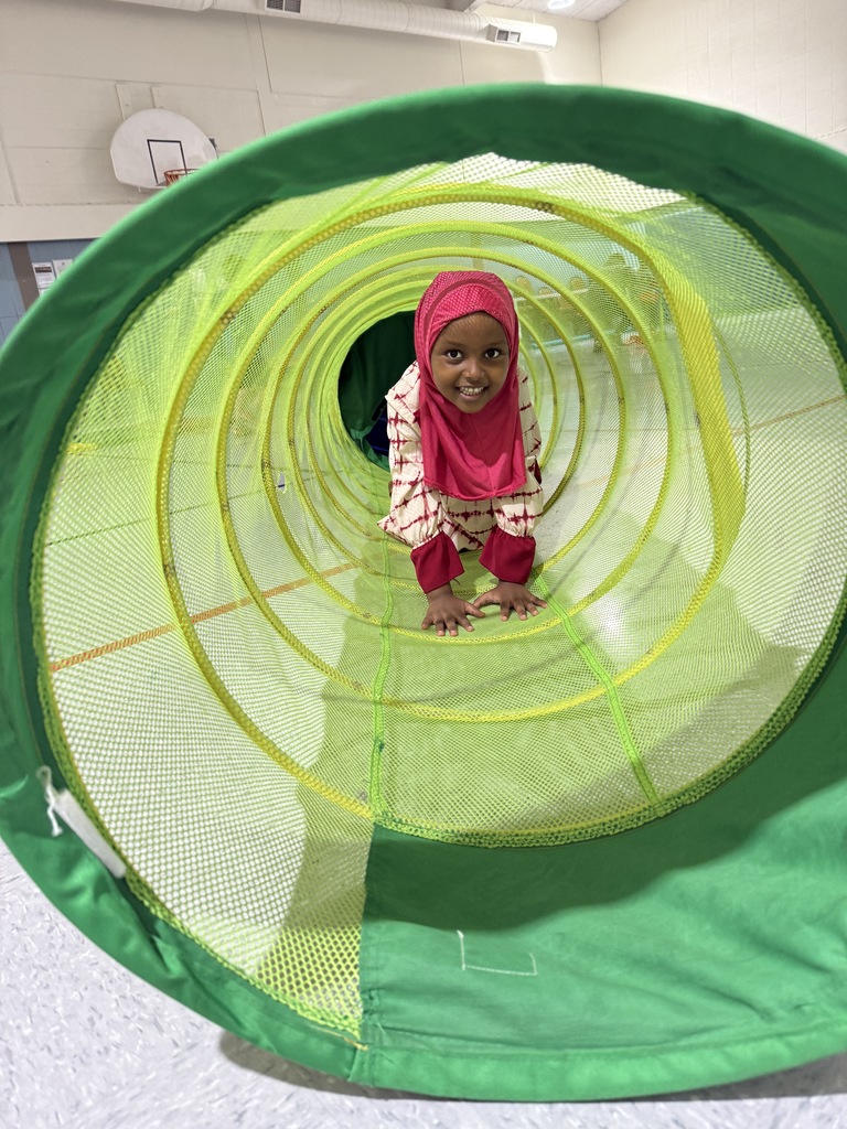 preschooler in tunnel