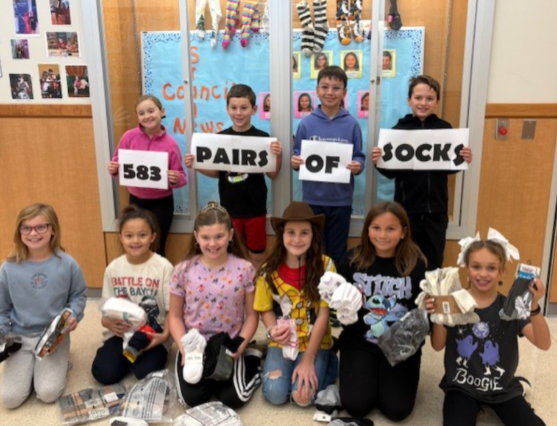 Kids holding up socks